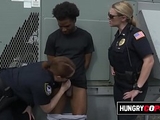 Black criminal is apprehended by two big titty MILFs.